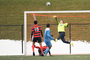 Hendrik Hilpert makes one of his eight saves in SU's Sweet 16 matchup against North Carolina. 