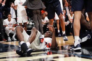 Bourama Sidibe lays on the hardwood. The junior made just one shot against the Nittany Lions.