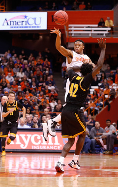 Syracuse guard Ron Patterson releases a pass over Kennesaw State's Damien Wilson.