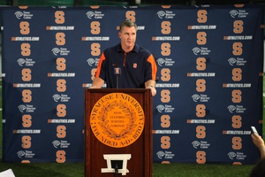 Syracuse head coach Doug Marrone addresses the media Saturday as his players reported for preseason camp. The Orange begins practice Monday.