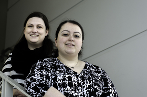 (From left) Taylor Brady and Katherine Desy, both seniors in the Martin J. Whitman School of Management, assist women inmates at the Onondaga County Department of Correction by offering resume and cover letter workshops every Friday.