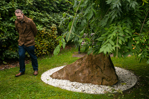 Stephen Armstrong, a 2000-01 Lockerbie Scholar, walks by the Sherwood Crescent memorial in Lockerbie, Scotland on Oct. 16, 2015. The memorial marks where the wings of Pan Am Flight 103 created a crater and started a huge fire upon impact.