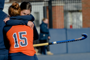 Zoe Wilson (15) celebrates after capturing a national semifinal win over Connecticut. The SU backs helped spur the win. 