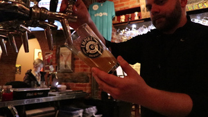 An Empire Brewery employee pours one of the many beers they brew in the restaurant.