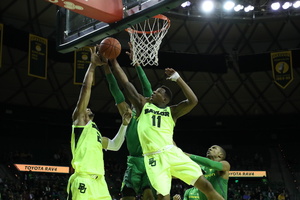 Baylor guard/forward Mark Vital blocks a shot at the rim.