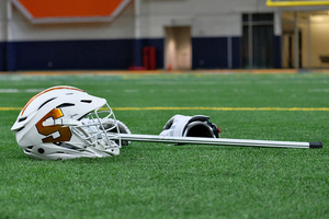 Casey Powell, a Syracuse lacrosse legend, is now a volunteer assistant coach for Northwestern's women's lacrosse team. 