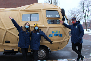 Ally Toolan, Grace Noice and Tyler Towne (left to right) are visiting SU this week in the NUTmobile to “spread smiles in the salty streets,” Noice said. 