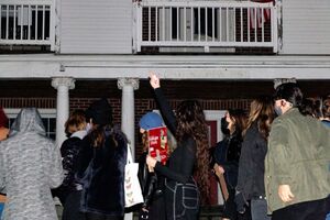 Multiple windows of Phi Kappa Psi were covered with what appeared to be blackout curtains and black vinyl trash bags. Some of the lights were turned on inside the house.