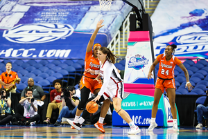 NC State's River Baldwin operates down low against Syracuse's Saniaa Wilson. Baldwin shot a perfect 7-7 from the field for 16 points. 