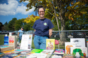 Sarah Perina, general manager of Parthenon Books, showcases the selection of books sold at her store that are written by Jewish authors. Perina, while not Jewish herself, hopes to connect with the community and advertise Parthenon Books. 