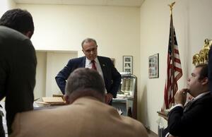 Steve Kimatian learns about his defeat surrounded by his committee behind closed doors at the Onondaga County Republican Committee building.