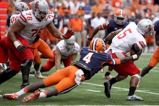 Brandon Reddish makes a tackle on running back Miguel Maysonet.