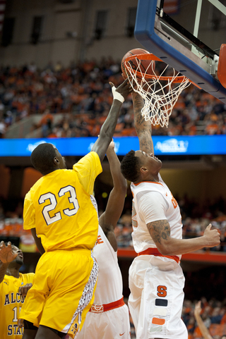 DaJuan Coleman attempts a dunk past Alcorn State forward Josh Nicholas.