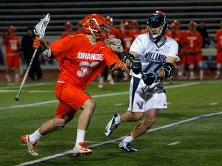 Scott Loy tries to shake off Villanova midfielder Remington Pope.