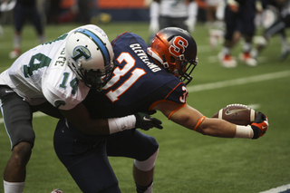 Syracuse fullback Clay Cleveland stretches for the end zone.