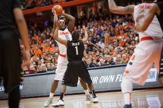 C.J. Fair towers over Binghamton's Marlon Beck and looks to pass. 