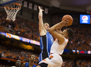 Ennis is fouled while attempting a shot over Marshall Plumlee.