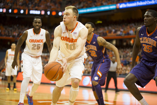 Trevor Cooney attacks the basket as Rakeem Christmas looks on. 