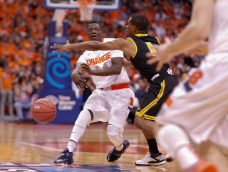 Joseph looks to pass to his right against the Owls' defense.