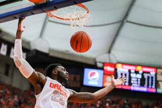 Christmas drives his way into the paint for a dunk, early in the second half.