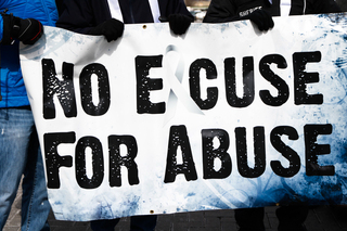 Marchers hold a sign 