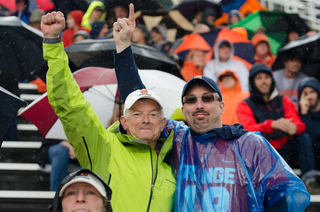 Joe Paduda (left), father of senior midfielder Cal Paduda, leads the SU fan section. 