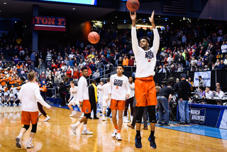 Junior point guard warms up. He missed two practices over the past few days as he battled strep throat. 