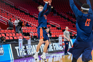 Braedon Bayer takes a jump shot against Paschal Chukwu.