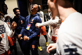 Elijah Hughes pumps up the team before the 10 p.m. tip, Syracuse's latest start time this season. 