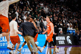 Bayer and the Orange celebrate the win as the final buzzer sounded. 