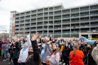 Dancers wave to the children watching out the windows at the children’s hospital after their performance. 