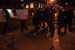 Candles light leads the way as students and allies march across campus at the Take Back the Night event. 