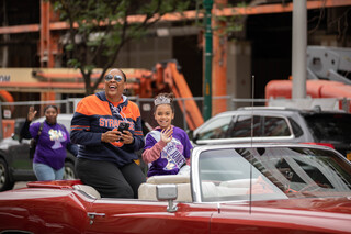 Syracuse women's basketball coach and Grand Marshal Felisha Legette-Jack rides in a convertible towards the front of the Syracuse Victory Parade as part of the Juneteenth celebrations, June 18th, 2022.